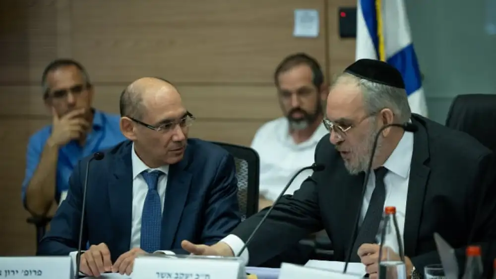 Governor of the Bank of Israel Amir Yaron (left) attends a committee meeting at the Knesset in Jerusalem, July 19, 2023. Photo by Yonatan Sindel/Flash90.