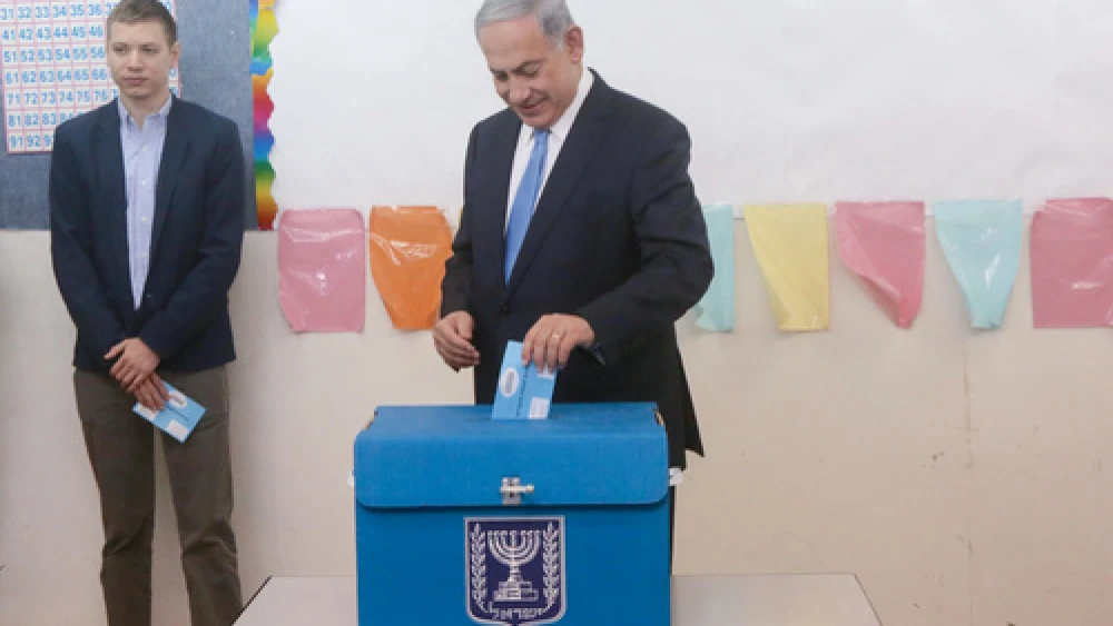 Israeli Prime Minister Benjamin Netanyahu votes in Israel's last election. Credit: Marc Israel Sellem/POOL/Flash90.