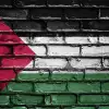 Palestinian Flag on Brick Wall