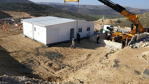 First caravilla is erected on the grounds of the new Amichai settlement for evacuees of Amona on Feb. 21, 2018. Credit: Amona evacuees.