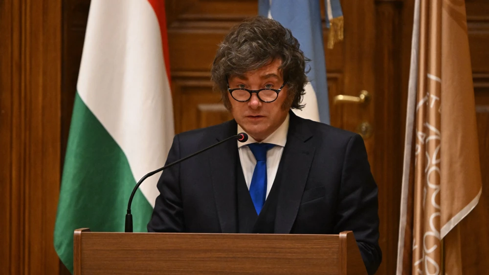Argentina's President Javier Milei holds the acceptance speech after receiving his honorary doctorate from the Ludovika University of Public Service in Budapest on March 21, 2026, on the sidelines of the Conservative Political Action Conference (CPAC). Photo by Attila Kisbenedek/AFP via Getty Images.
