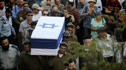 Friends and relatives mourn at the funeral of IDF Sgt. Barkey Ishai Shor on Mount Herzl in Jerusalem on July 29, 2014. Shor was one of 66 Israeli soldiers killed during last summer's war with Hamas. Credit: Miriam Alster/Flash90.