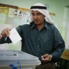 An Arab man casts his vote in the municipal elections in the West Bank town of Al-Bireh on Oct. 20, 2012. Photo by Issam Rimawi/Flash90.