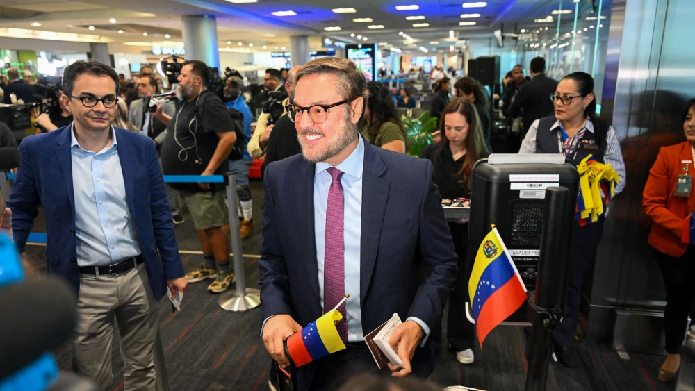 Venezuelan Representative to the U.S. Felix Plasencia boards an American Airlines flight to Caracas at Miami International Airport on April 30, 2026, marking the first direct flight between the two nations in seven years. Photo by Chandan Khanna/AFP via Getty Images.