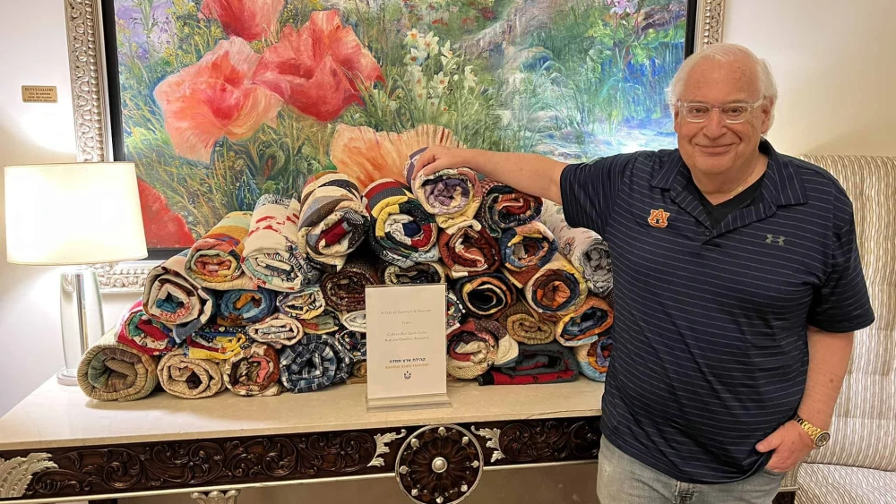 Former U.S. Ambassador to Israel David Friedman presents IDF families with handmade quilts from the Cotton Boll Quilt Guild of Auburn, Alabama, March 19, 2024. Credit: David Friedman/X.