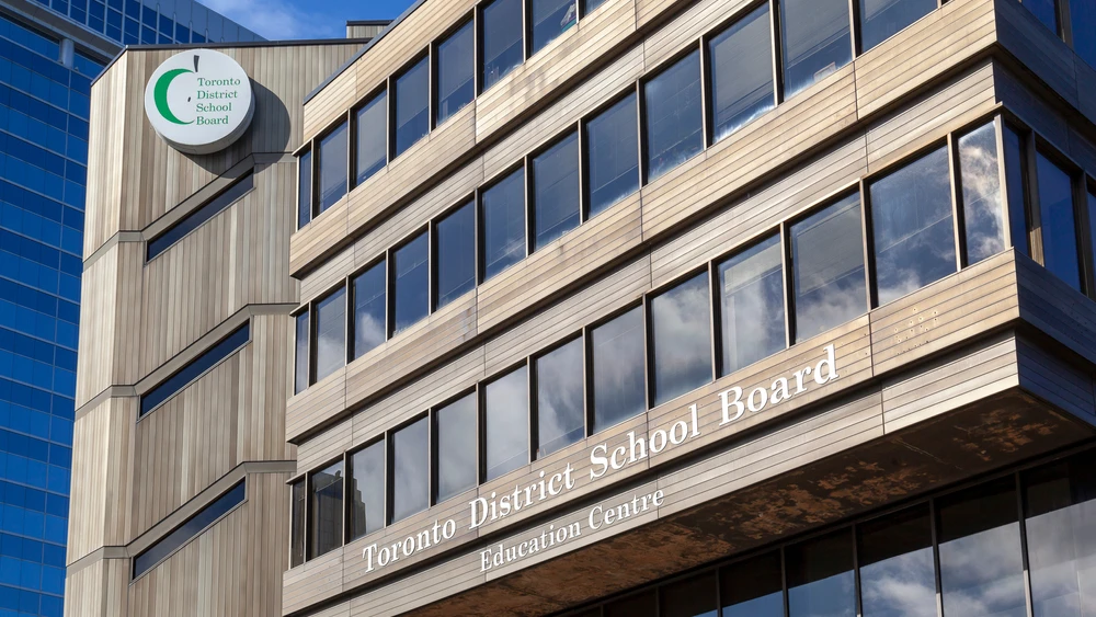 Toronto District School Board (TDSB) sign on the headquarters building in Toronto. Credit: JHVE Photo/Shutterstock.
