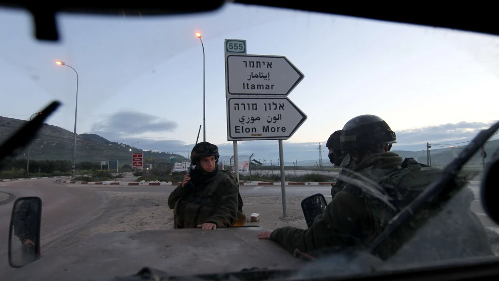 Israeli soldiers block a road near Huwara, south of the Samaria city of Nablus (Shechem), March 12, 2011. Photo by Nati Shohat/Flash90.