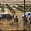 Lebanese soldiers and Hezbollah fighters taking pictures during a fire that spread from the Lebanese side of the border to the Israeli side of the border in Kibbutz Malkia, northern Israel, July 28, 2023. Photo by Ayal Margolin/Flash90.
