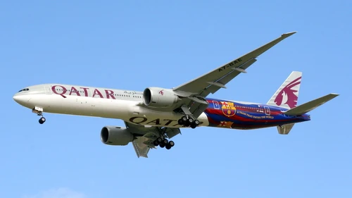 A Qatar Airways plane that in its back half bears the logo of Spain’s FC Barcelona soccer team, indicative of the close relationship between European soccer clubs and Qatari coffers. Credit: John Taggart via Wikimedia Commons.