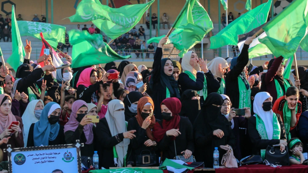 Hamas supporters wave flags during a rally in Gaza City, on May 24, 2021. Photo by Atia Mohammed/Flash90.