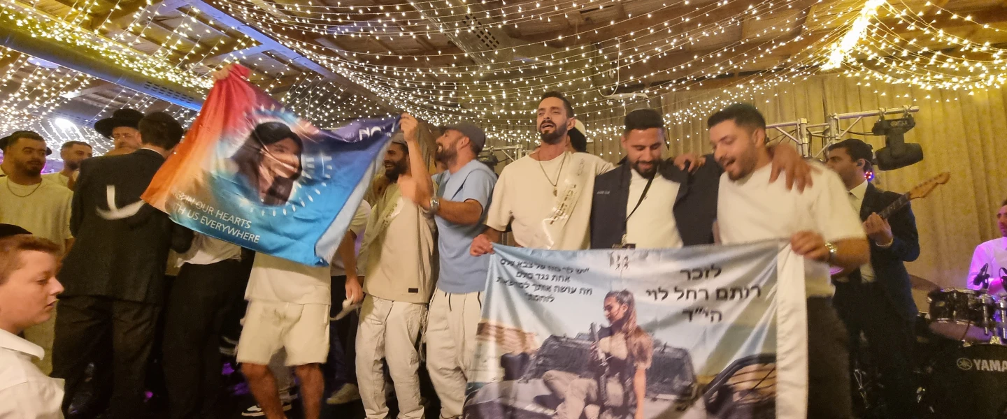Survivors of the Supernova music festival massacre celebrate "Hakafot Shniyot" at the David Castle event hall in Jerusalem on Oct. 3, 2026. Photo by Sharon Altshul.
