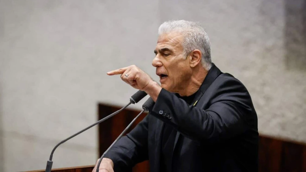 Opposition Leader Yair Lapid of the Yesh Atid Party during the preliminary reading of a bill to establish a “special state commission of inquiry” into the events of Oct. 7, 2023, in the Knesset, Dec. 24, 2025. Credit: Knesset website.
