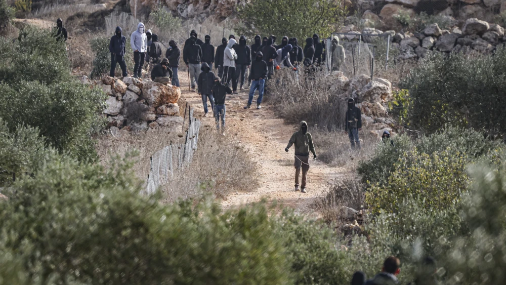 Israelis and Palestinians clash during the annual olive harvest in the village of Khirbet Abu Falah, north of Ramallah, where several people, including American photojournalist Heidi Levine, were injured on Oct. 16, 2026. Photo by Flash90.