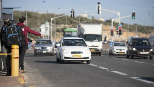 Jewish youth hitchhiking at Giti Avishar Junction on Route 5 in Samaria, Jan. 26, 2020. Photo by Sraya Diamant/Flash90.