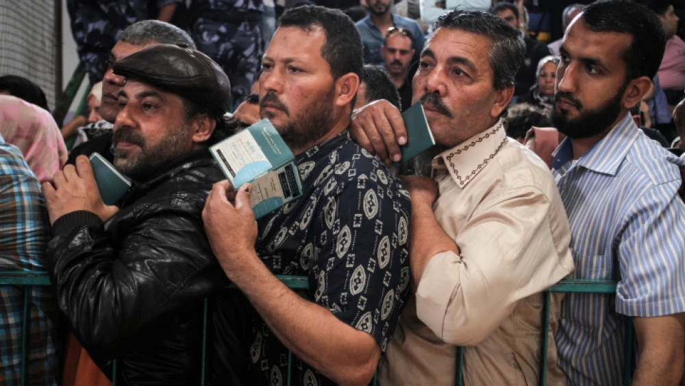 Palestinians wait at the Rafah border crossing with Egypt in southern Gaza after it was opened for two days by Egyptian authorities on May 11, 2016. Photo by Abed Rahim Khatib/ Flash90.