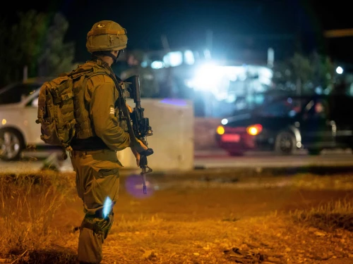 Israeli troops stand near the scene of a suspected car-ramming attack at the entrance to the village of Husan in Judea, June 23, 2018. Photo by Aharon Krohn/Flash90.