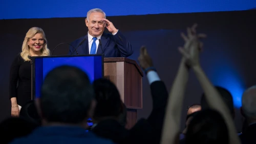 Israeli Prime Minister Benjamin Netanyahu and his wife, Sara, addresses supporters as the results in Israel's national elections are announced at party headquarters in Tel Aviv on April 9, 2019. Photo by Yonatan Sindel/Flash90.