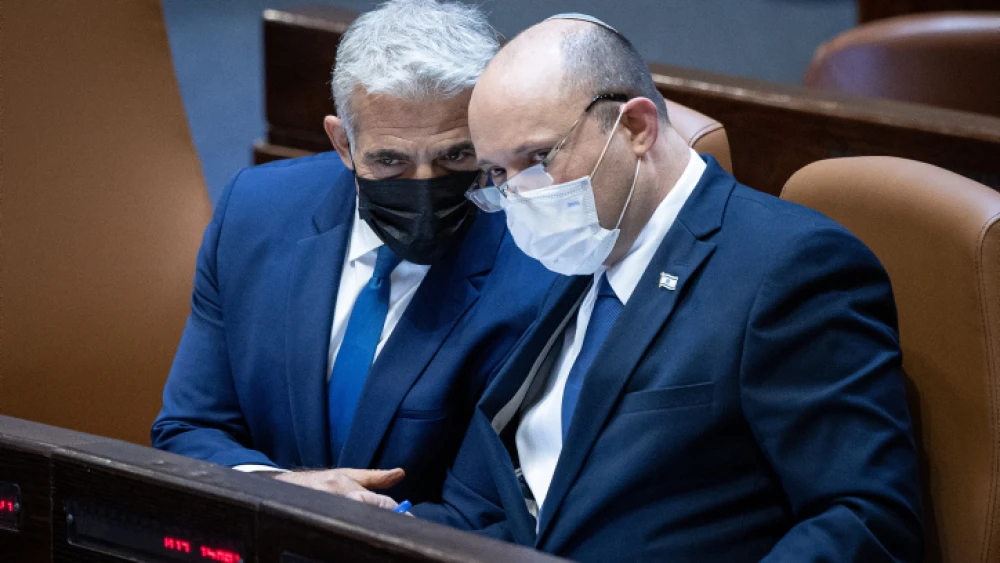 Israeli Foreign Affairs Minister Yair Lapid (left) and Israeli Prime Minister Naftali Bennett during a plenum session in the Knesset on Aug. 2, 2021. Photo by Yonatan Sindel/Flash90.