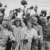 Survivors at the Dachau concentration camp cheer their liberation by U.S. soldiers. Credit: United States Holocaust Memorial Museum, Courtesy of National Archives and Records Administration, College Park, Md.