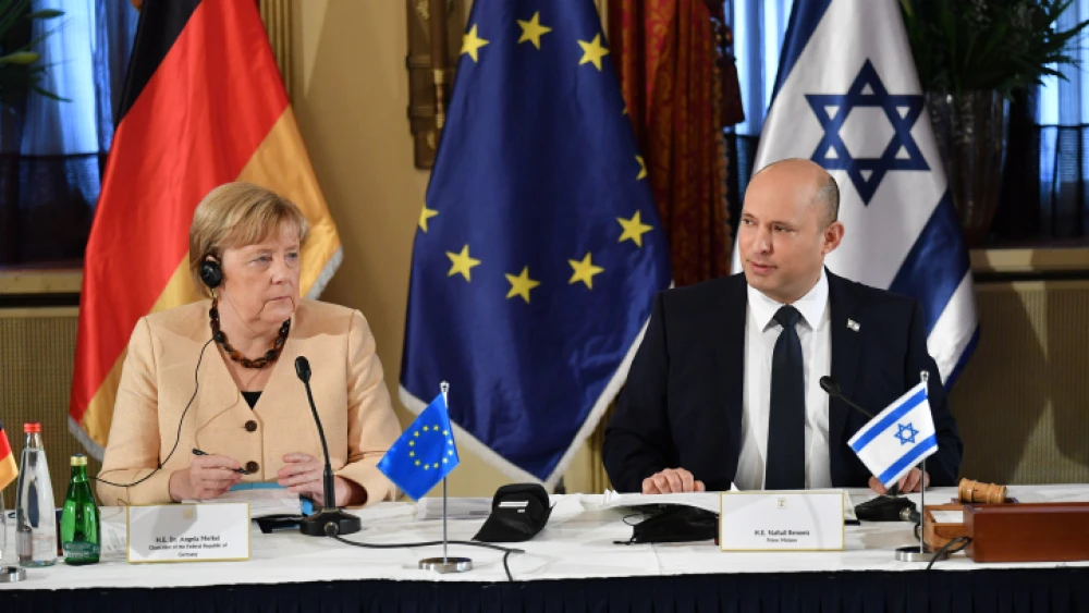German Chancellor Angela Merkel with Israeli Prime Minister Naftali Bennett at a special Cabinet session at the King David Hotel in Jerusalem, Oct. 10, 2021. Photo by Yoav Dudkevitch/POOL.