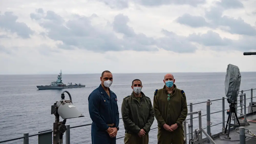 Capt. Joe Bagget, “USS Monterey” commanding officer, left, and Israeli Navy Commander Baruch Haviv (center) aboard the Ticonderoga-class guided-missile cruiser in the Eastern Mediterranean Sea, March 15, 2021. Credit: U.S. Navy.