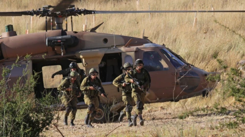 Members of the Israeli Air Force's Unit 669 combat search and rescue extraction unit exit a UH-60 Blackhawk helicopter, May 28, 2013. Photo by Ofer Zidon/Flash90.