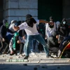 Palestinian and Arab-Israeli rioters hurl rocks at Israeli security forces during Ramadan prayers at the Al-Aqsa mosque on the Temple Mount in the Old City of Jerusalem, April 15, 2022. Photo by Jamal Awad/Flash90.