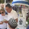 Harriet and Mark Levin at the grave of their son, Staff Sgt. Michael Levin, at the Mount Herzl Military Cemetery in Jerusalem, during a ceremony marking the 20th anniversary of his death, July 30, 2026. Photo by Liora Rubinstein.