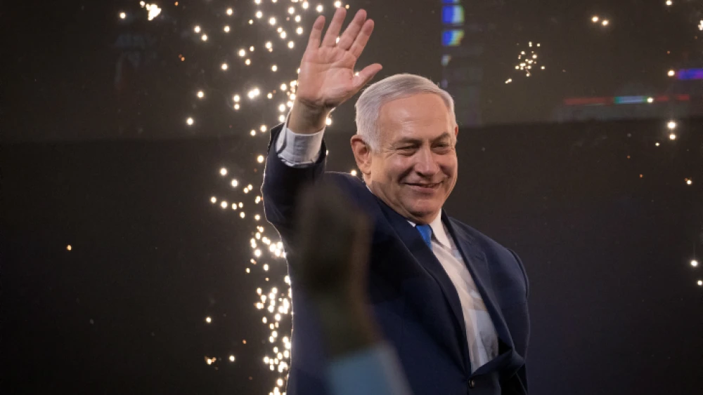 Israeli Prime Minister Benjamin Netanyahu waves to supporters at Likud Party headquarters in Tel Aviv on April 9, 2019. Photo by Yonatan Sindel/Flash90.