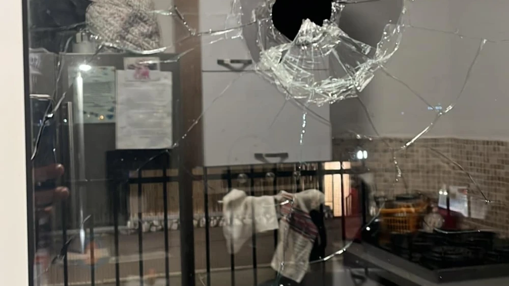 A close-up image of the bullet hole in L's kitchen window in Shaked, in Samaria. According to the Samaria Regional Council, Palestinian terrorists have fired on Shaked seven times in recent months. Credit: Samaria Regional Council.