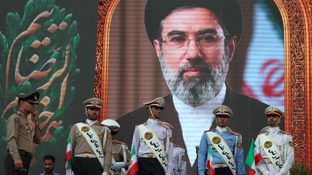 Iranian soldiers stand in front of a picture of Ayatollah Mojataba Khamenei during a rally to show their support to the new supreme leader, April 29, 2026. Photo by AFP via Getty Images.