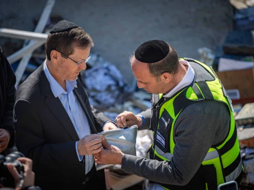 President Isaac Herzog visit at the scene where a ballistic missile fired from Iran struck Beit Shemesh, central Israel, causing extensive destruction and killing at least nine people, March 2, 2026. Photo by Yonatan Sindel/Flash90.