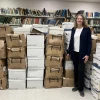 Director of Digital Scholarship Alison Joseph, Ph.D., surveys the mountain of boxes of Elie Wiesel's private collection—the crown jewel of the Grayzel Digital Platform which launches on Thursday, Nov. 6, 2025. Credit: Courtesy.