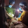 Israeli and Ethiopian doctors operating on a three-year-old child during a power failure at the St. Peter’s Hospital in Addis Ababa, Ethiopia. Photo by Dr. Vasile Recea via TPS.