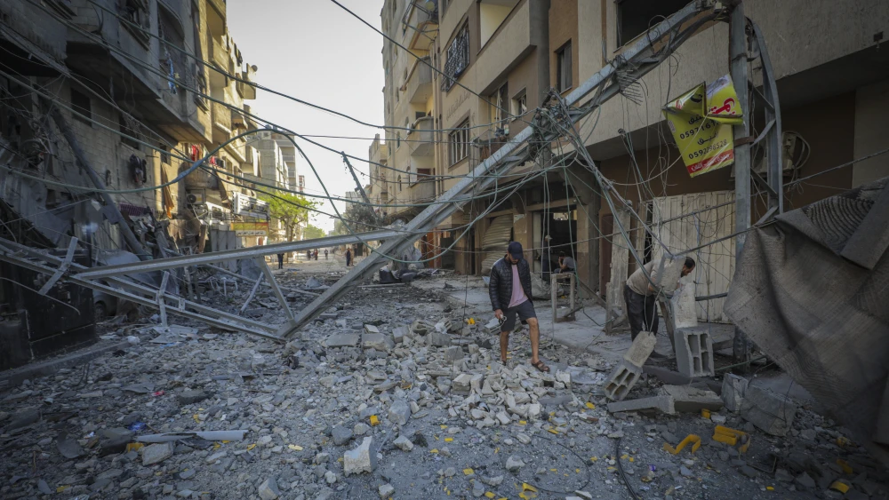 Palestinians inspect the damage to their homes following an Israeli airstrike on the Nuseirat refugee camp in the central Gaza Strip, on May 23, 2026. Photo by Ali Hassan/Flash90.