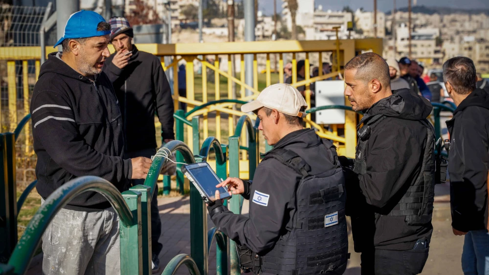 Palestinian workers enter the Israeli town of Ma’ale Adumim following an attempted stabbing attack, Feb. 23, 2023. Photo by Erik Marmor/Flash90.