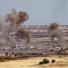 A picture taken from the Israeli side depicts smoke rising near the Israeli-Syrian border in the Golan Heights during fights between the rebels and the Syrian army, June 25, 2017. Photo by Basel Awidat/Flash90.