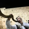 A shofar is blown at the Western Wall in Jerusalem's Old City, at the end of Yom Kippur, Oct. 12, 2016. Photo by Flash90.
