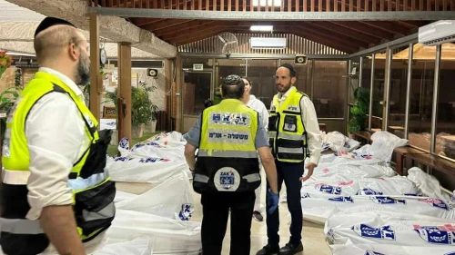 ZAKA search and rescue volunteers at Kibbutz Be'eri identify the bodies of Israelis slain by Hamas terrorists from Gaza, Oct. 11, 2023. Credit: ZAKA.
