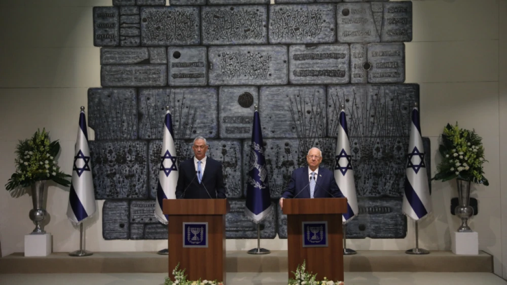 Israeli President Reuven Rivlin presents Blue and White Party leader Benny Gantz with the mandate to form a new Israeli government, after Prime Minister Benjamin Netanyahu's failure to form one, at the President's Residence in Jerusalem on Oct. 23, 2019. Photo by Yonatan Sindel/Flash90.