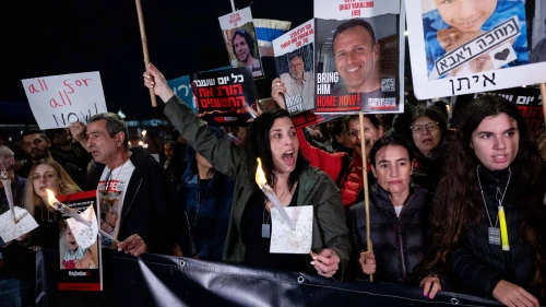 Israelis and families of Israelis held hostage by Hamas terrorists in Gaza, hold torches as they march towards the Israeli parliament in Jerusalem, on the fifth night of the Jewish holiday of Chanukah, as they call for the release of the hostages. Dec. 12, 2023. Photo by Yonatan Sindel/Flash90.