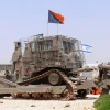 An IDF Caterpillar D9. At its 2014 General Assembly, Presbyterian Church USA targeted Caterpillar for its resolution to divest from Israel because Israel allegedly “weaponizes” Caterpillar tractors—a misnomer for the fact that Israel puts armor on them to protect operators from IEDs (improvised explosive devices) and other attacks—and because its tractors are used to build the West Bank security fence, write Roberta P. Seid and Roz Rothstein. Credit: MathKnight via Wikimedia Commons.