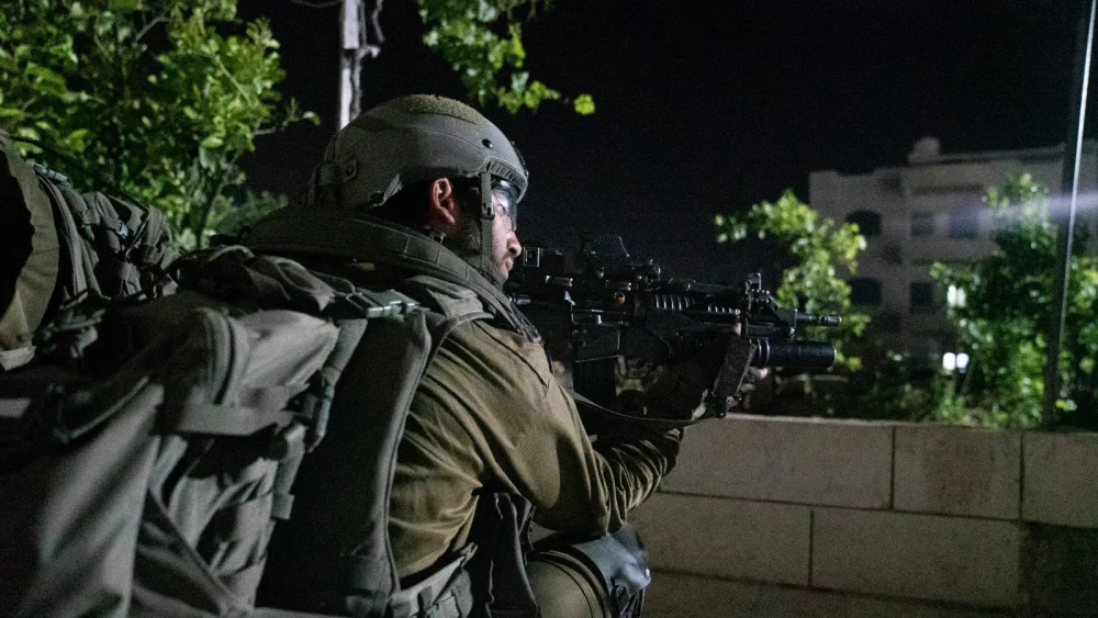 An Israeli soldier during a nighttime counterterror operation in Judea and Samaria. Credit: IDF.