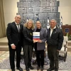 Jewish Agency CEO Yehuda Setton (left); Jewish Agency’s Fund for the Victims of Terror chair Ayelet Nahmias-Verbin; and Jewish Agency chairman Maj. Gen. (res.) Doron Almog present the report to first lade Michal Herzog (second from right), Feb. 17, 2025. Credit: Courtesy.