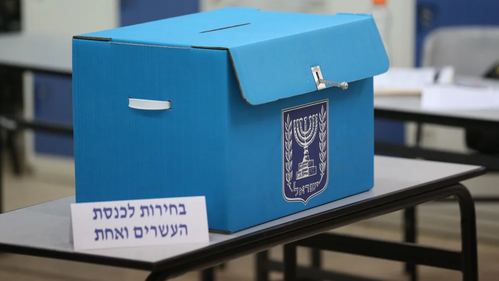Israeli citizens cast their ballots at a voting station during the Knesset elections on April 9, 2019. Photo by David Cohen/Flash90.