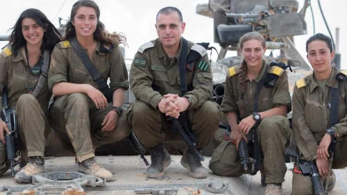 The first four female tank commanders in the Israel Defense Forces pose with Brig. Gen. Guy Hasson, head of the Armored Corps. Credit: IDF Spokesperson Unit.