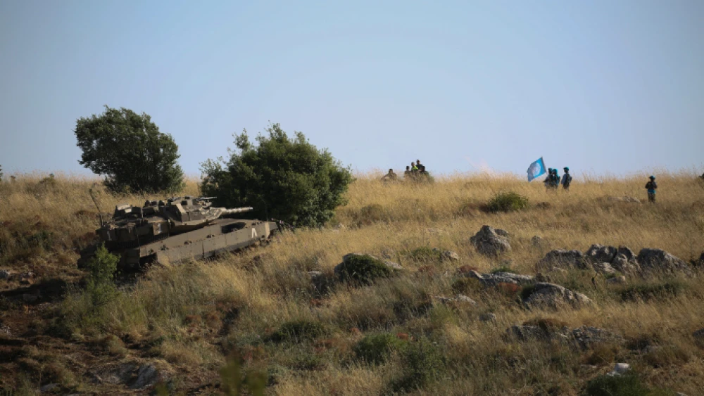 An Israeli Merkava tank takes part in routine manuevers near the "blue line" drawn by the United Nations to mark Israel's withdrawal from southern Lebanon in 2000, on June 2, 2020. Photo by David Cohen/Flash90.