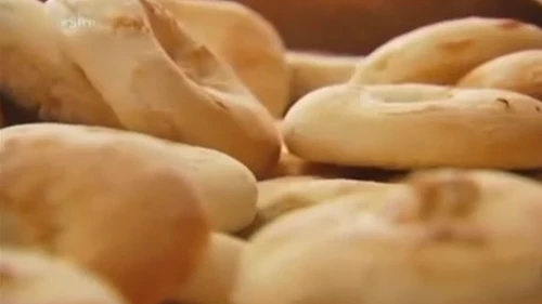 Click photo to download. Caption: Bialys from Kossar's, formerly owned by Juda Engelmayer and his wife. Credit: YouTube.