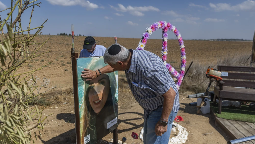 Family members visit a memorial for Liraz Assulin near the Israeli border with the Gaza Strip. Assulin was murdered by a Hamas terrorist during the October 7 massacre, just days before the third anniversary of the attack, October 4, 2026. Photo by Chaim Goldberg/Flash90.