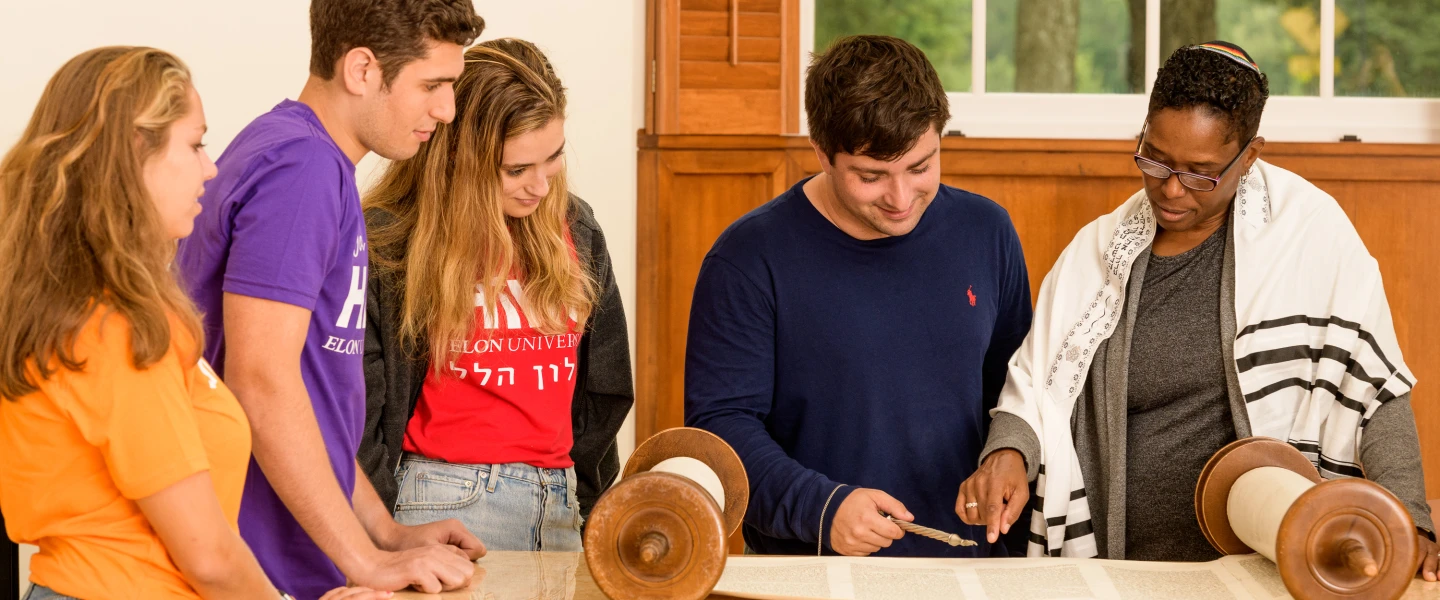 Students at Elon University in North Carolina read from the Torah. Credit: Elon University Hillel.
